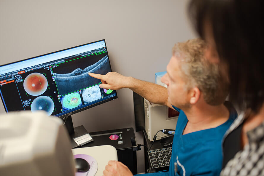 Dr. Doering looking at retina scan